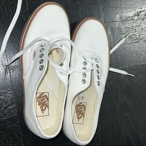 BRAND NEW size 7M Vans never worn. White canvas upper with a gum bottom.